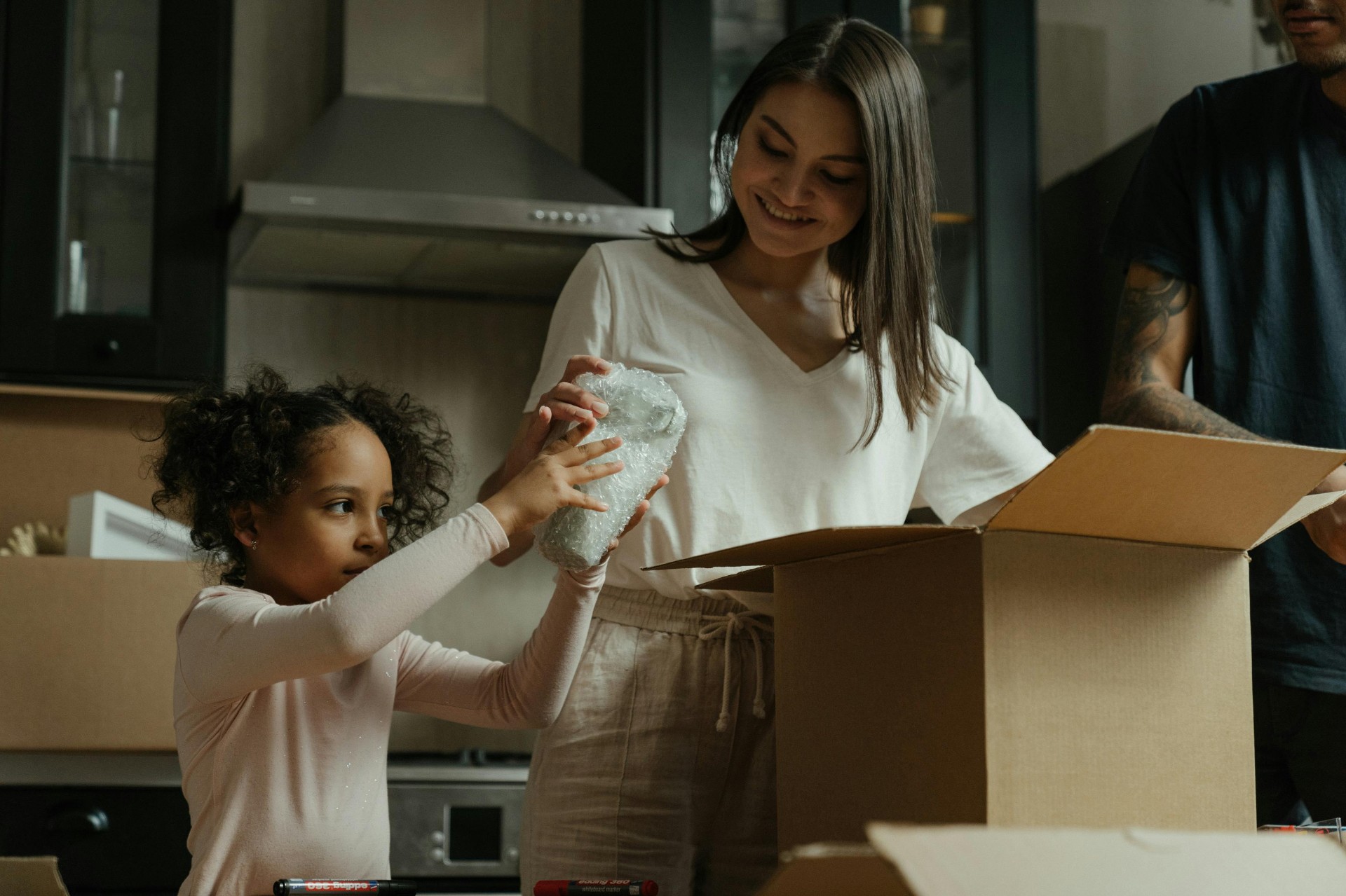 Unpacking boxes on move-in day at a new Wisconsin apartment